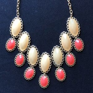 Necklace with large coral and cream stones